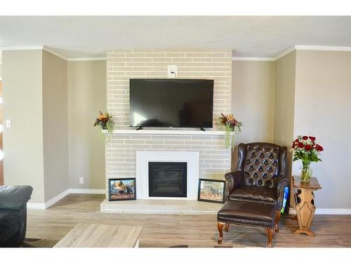 4913 54 Street, Athabasca, AB - Indoor Photo Showing Living Room With Fireplace