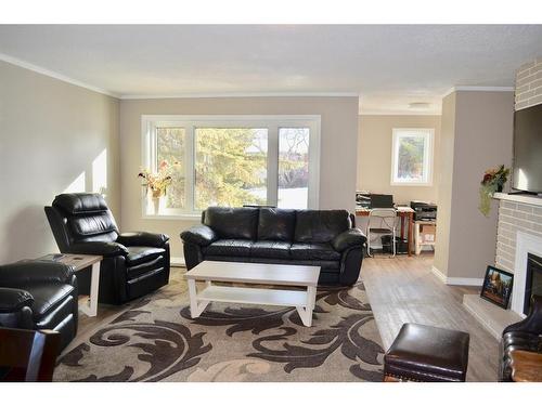 4913 54 Street, Athabasca, AB - Indoor Photo Showing Living Room With Fireplace