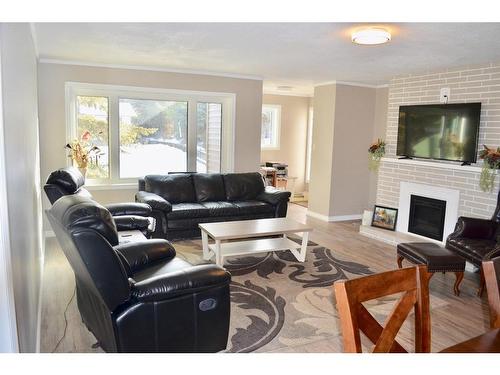 4913 54 Street, Athabasca, AB - Indoor Photo Showing Living Room With Fireplace