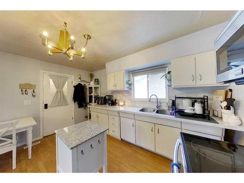 321 3 Avenue Nw, Slave Lake, AB - Indoor Photo Showing Kitchen With Double Sink