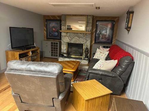 21 Chaisson Crossing, Whitecourt, AB - Indoor Photo Showing Living Room With Fireplace