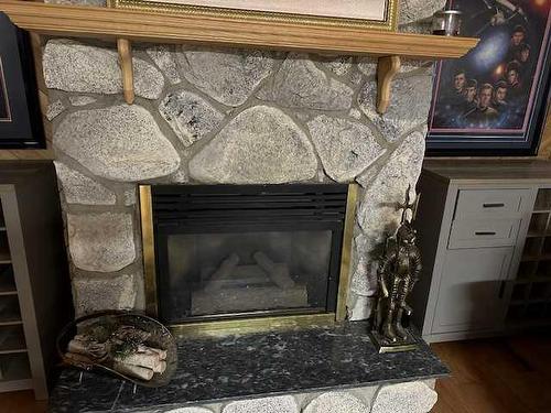 21 Chaisson Crossing, Whitecourt, AB - Indoor Photo Showing Living Room With Fireplace