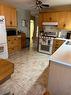 21 Chaisson Crossing, Whitecourt, AB  - Indoor Photo Showing Kitchen With Double Sink 