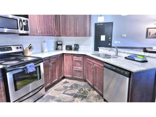 219-901 Mountain Street, Canmore, AB - Indoor Photo Showing Kitchen With Double Sink