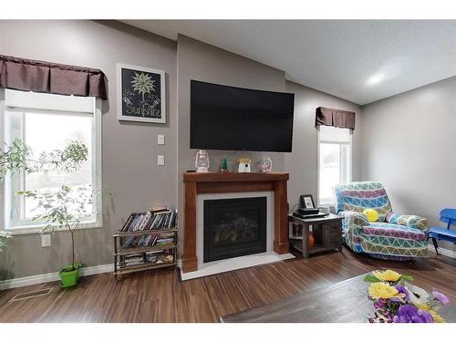 1217 Southshore Drive West, Canyon Creek, AB - Indoor Photo Showing Living Room With Fireplace