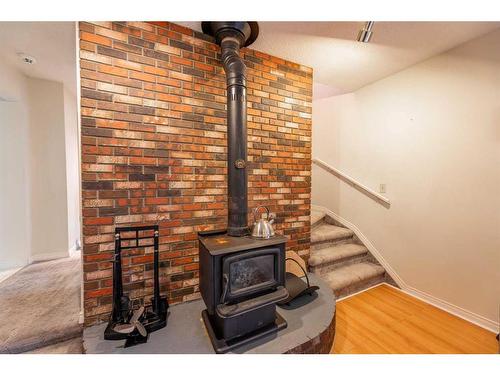 141 Sherwood Drive, Hinton, AB - Indoor Photo Showing Other Room With Fireplace