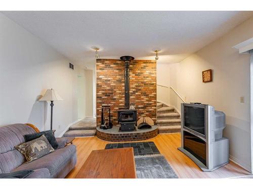 141 Sherwood Drive, Hinton, AB - Indoor Photo Showing Other Room With Fireplace