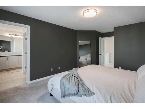 188 Emberside Hollow, Cochrane, AB - Indoor Photo Showing Bedroom