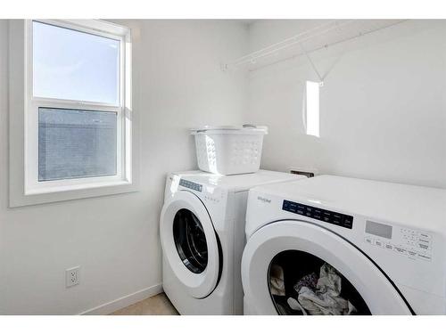 188 Emberside Hollow, Cochrane, AB - Indoor Photo Showing Laundry Room