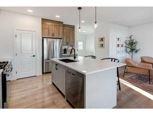 188 Emberside Hollow, Cochrane, AB - Indoor Photo Showing Kitchen With Double Sink With Upgraded Kitchen