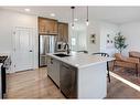 188 Emberside Hollow, Cochrane, AB  - Indoor Photo Showing Kitchen With Double Sink With Upgraded Kitchen 