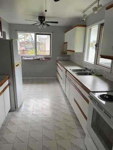 27 Beaver Drive, Whitecourt, AB - Indoor Photo Showing Kitchen With Double Sink