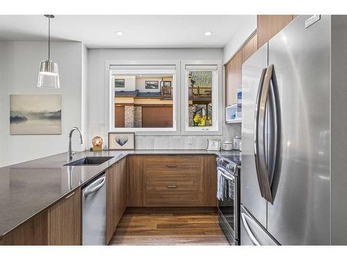 204I-209 Stewart Creek Rise, Canmore, AB - Indoor Photo Showing Kitchen With Upgraded Kitchen