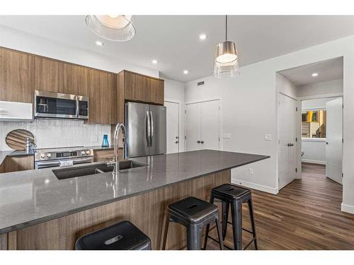 204I-209 Stewart Creek Rise, Canmore, AB - Indoor Photo Showing Kitchen With Upgraded Kitchen