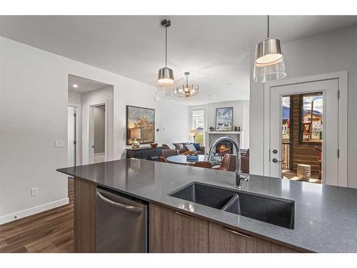 204I-209 Stewart Creek Rise, Canmore, AB - Indoor Photo Showing Kitchen With Double Sink