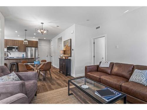 204I-209 Stewart Creek Rise, Canmore, AB - Indoor Photo Showing Living Room