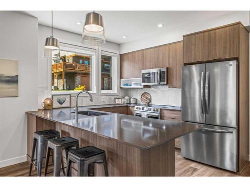 204I-209 Stewart Creek Rise, Canmore, AB - Indoor Photo Showing Kitchen With Upgraded Kitchen