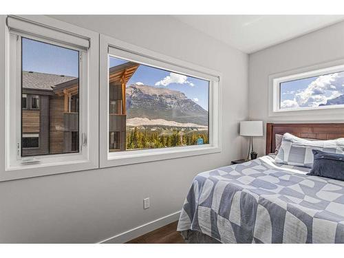 204I-209 Stewart Creek Rise, Canmore, AB - Indoor Photo Showing Bedroom