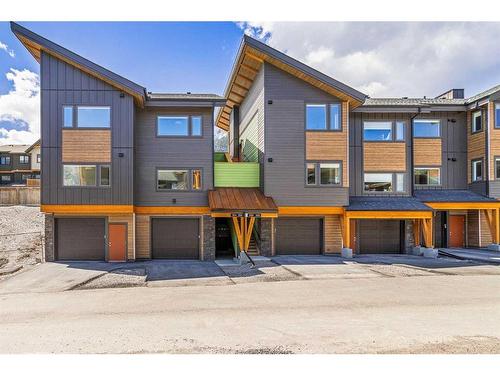 204I-209 Stewart Creek Rise, Canmore, AB - Outdoor With Facade