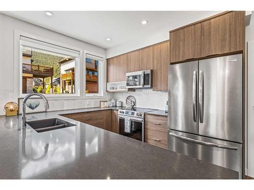 204I-209 Stewart Creek Rise, Canmore, AB - Indoor Photo Showing Kitchen With Double Sink With Upgraded Kitchen