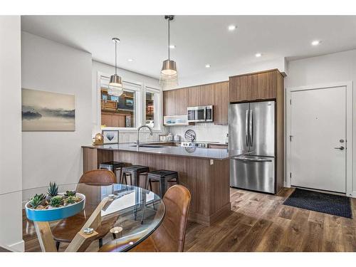 204I-209 Stewart Creek Rise, Canmore, AB - Indoor Photo Showing Kitchen With Upgraded Kitchen