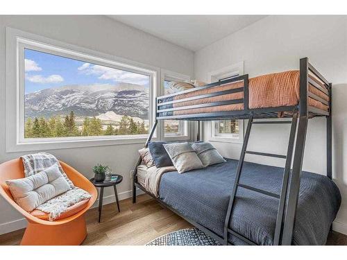 201F-209 Stewart Creek Rise, Canmore, AB - Indoor Photo Showing Bedroom