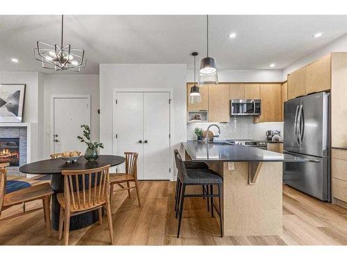 201F-209 Stewart Creek Rise, Canmore, AB - Indoor Photo Showing Kitchen With Upgraded Kitchen