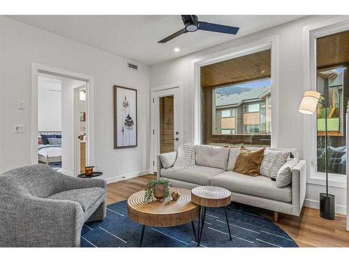 201F-209 Stewart Creek Rise, Canmore, AB - Indoor Photo Showing Living Room