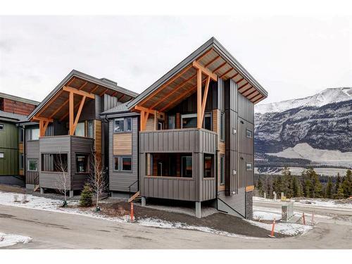 202F-209 Stewart Creek Rise, Canmore, AB - Outdoor With Facade