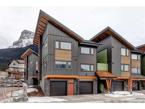 202F-209 Stewart Creek Rise, Canmore, AB - Outdoor With Facade