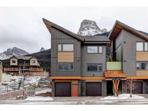 202F-209 Stewart Creek Rise, Canmore, AB - Outdoor With Facade