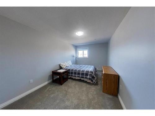 303-5037 7 Avenue, Edson, AB - Indoor Photo Showing Bedroom