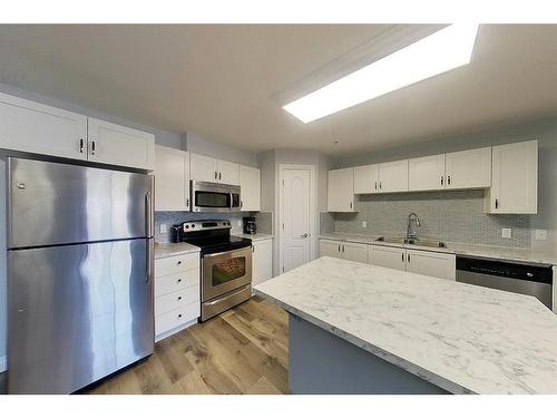 303-5037 7 Avenue, Edson, AB - Indoor Photo Showing Kitchen With Double Sink