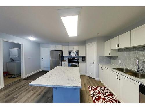 303-5037 7 Avenue, Edson, AB - Indoor Photo Showing Kitchen With Double Sink