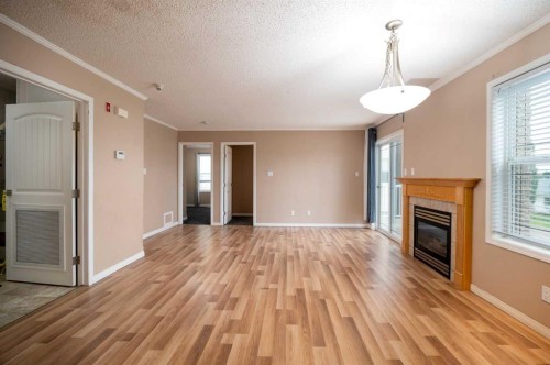 204-2814 48 Avenue, Athabasca, AB - Indoor Photo Showing Other Room With Fireplace