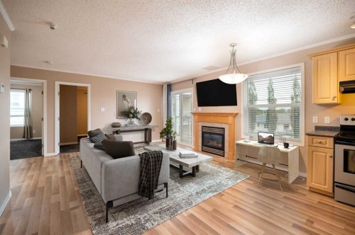 204-2814 48 Avenue, Athabasca, AB - Indoor Photo Showing Living Room With Fireplace