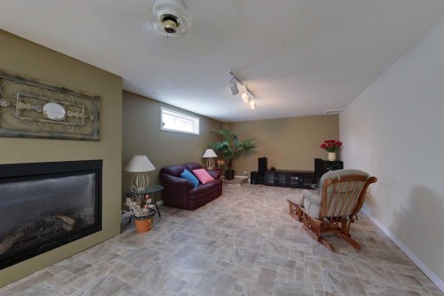 30 Executive Estates, Canyon Creek, AB - Indoor With Fireplace