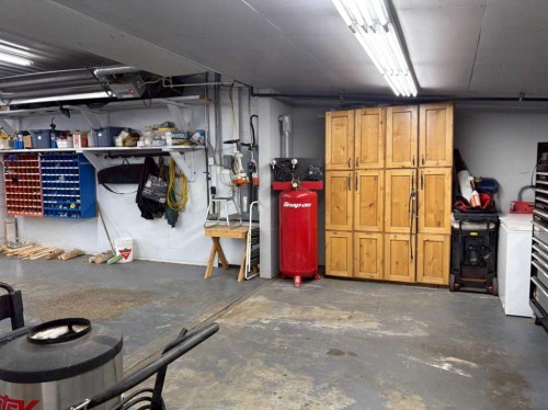 30 Executive Estates, Canyon Creek, AB - Indoor Photo Showing Garage