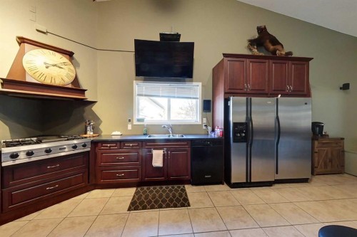 30 Executive Estates, Canyon Creek, AB - Indoor Photo Showing Kitchen With Double Sink