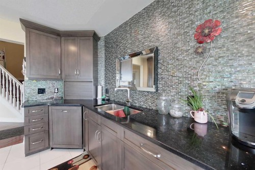 30 Executive Estates, Canyon Creek, AB - Indoor Photo Showing Kitchen With Double Sink