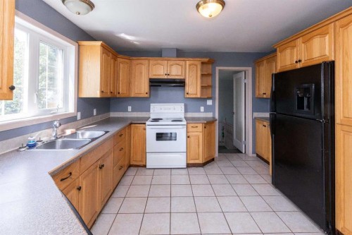 2584 Auger Road, Wabasca, AB - Indoor Photo Showing Kitchen With Double Sink