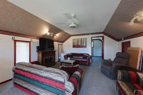 1 Johnson Drive, Marten Beach, AB - Indoor Photo Showing Living Room With Fireplace
