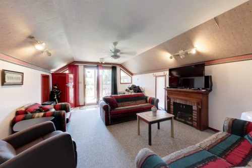 1 Johnson Drive, Marten Beach, AB - Indoor Photo Showing Living Room With Fireplace