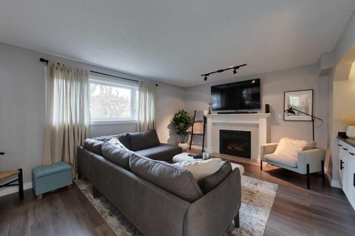 805 7 Avenue Sw, Slave Lake, AB - Indoor Photo Showing Living Room With Fireplace