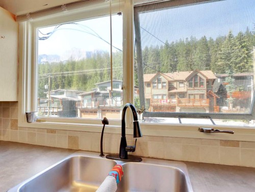 252 Three Sisters Drive, Canmore, AB - Indoor Photo Showing Kitchen With Double Sink