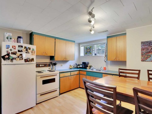 252 Three Sisters Drive, Canmore, AB - Indoor Photo Showing Kitchen With Double Sink