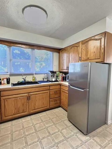 800 Connaught Drive, Jasper, AB - Indoor Photo Showing Kitchen With Double Sink