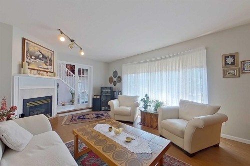 4102 Hees Drive, Athabasca, AB - Indoor Photo Showing Living Room With Fireplace