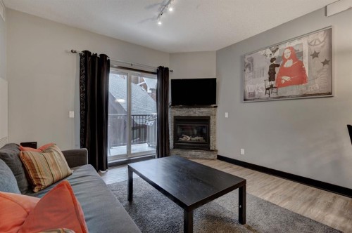202-901 Mountain Street, Canmore, AB - Indoor Photo Showing Living Room With Fireplace