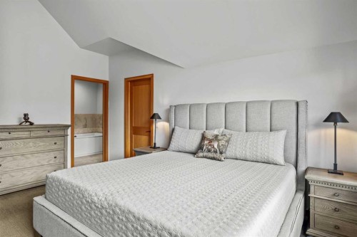 7 Creekside Mews, Canmore, AB - Indoor Photo Showing Bedroom